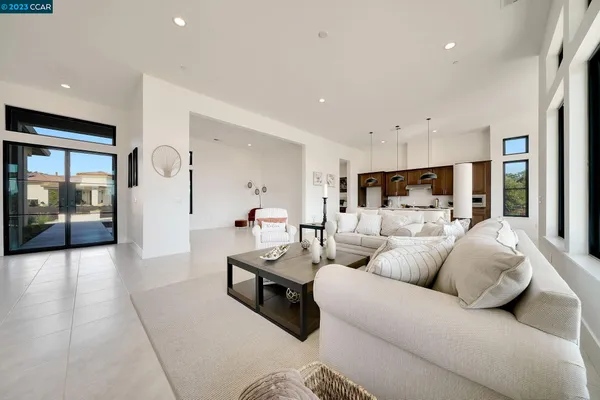 a living room with furniture and a large window