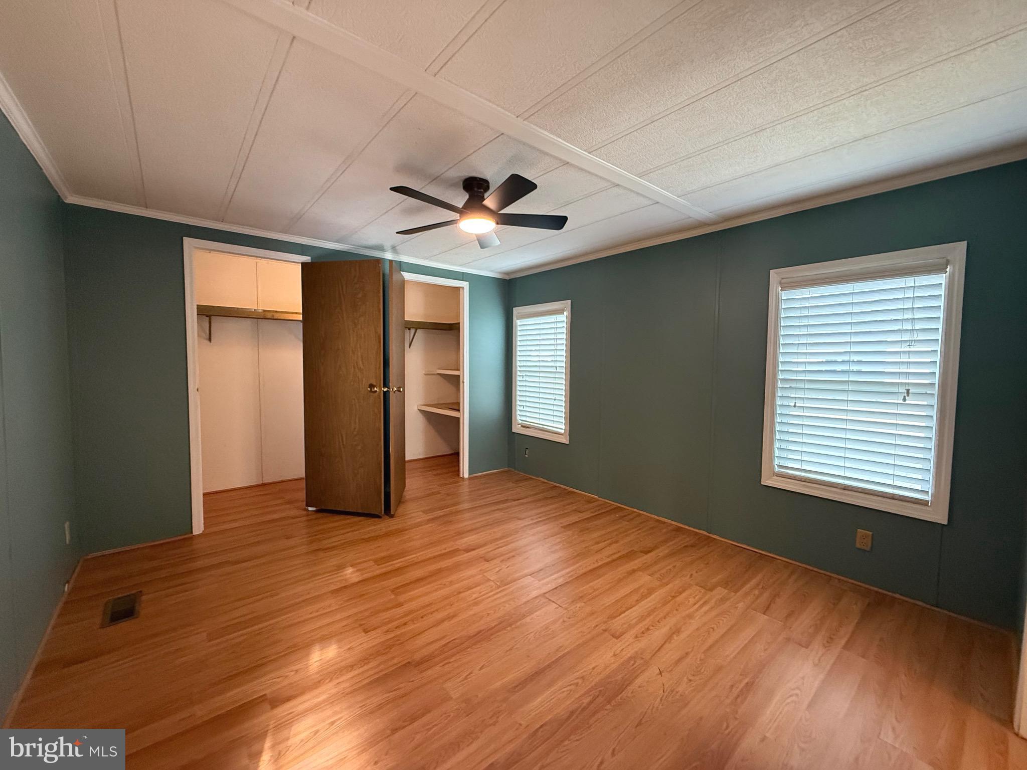 386 Indian Way Buena, NJ 08310 - Photo 30 of 53 a view of an empty room with window and wooden floor