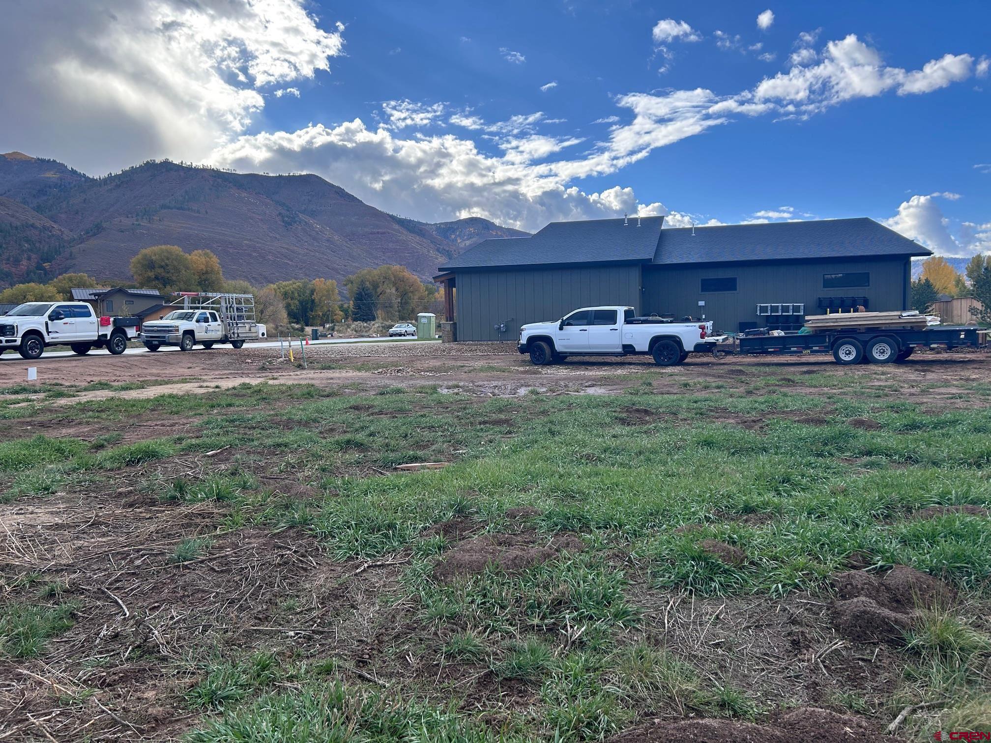 95 West Dalton Road Durango, CO 81301 - Photo 3 of 30 a view of a yard with table and chairs under an umbrella