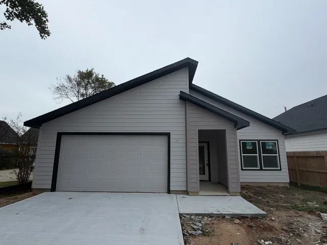 a front view of a house with a garage