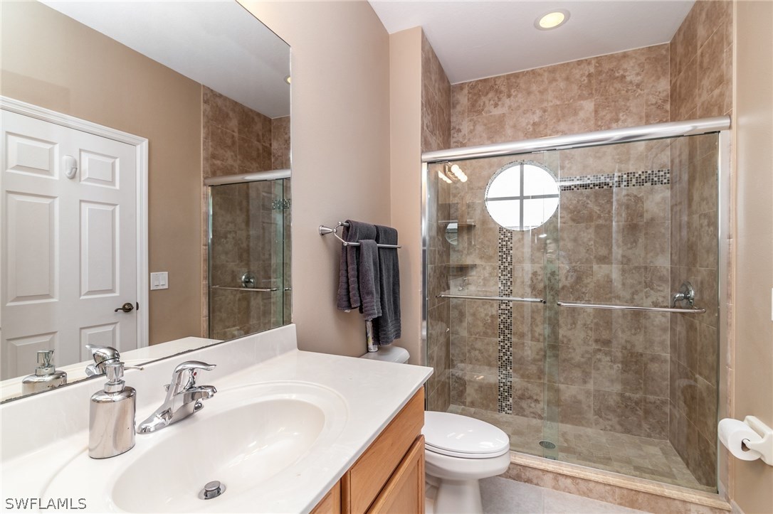 3968 Cherrybrook Loop Fort Myers, FL 33966 - Photo 15 of 16 a bathroom with a sink toilet and shower