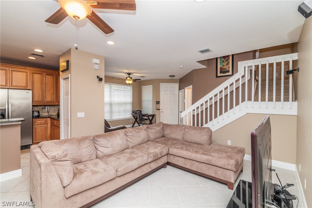 3968 Cherrybrook Loop Fort Myers, FL 33966 - Photo 6 of 16 a living room with furniture or chandelier and a dining table