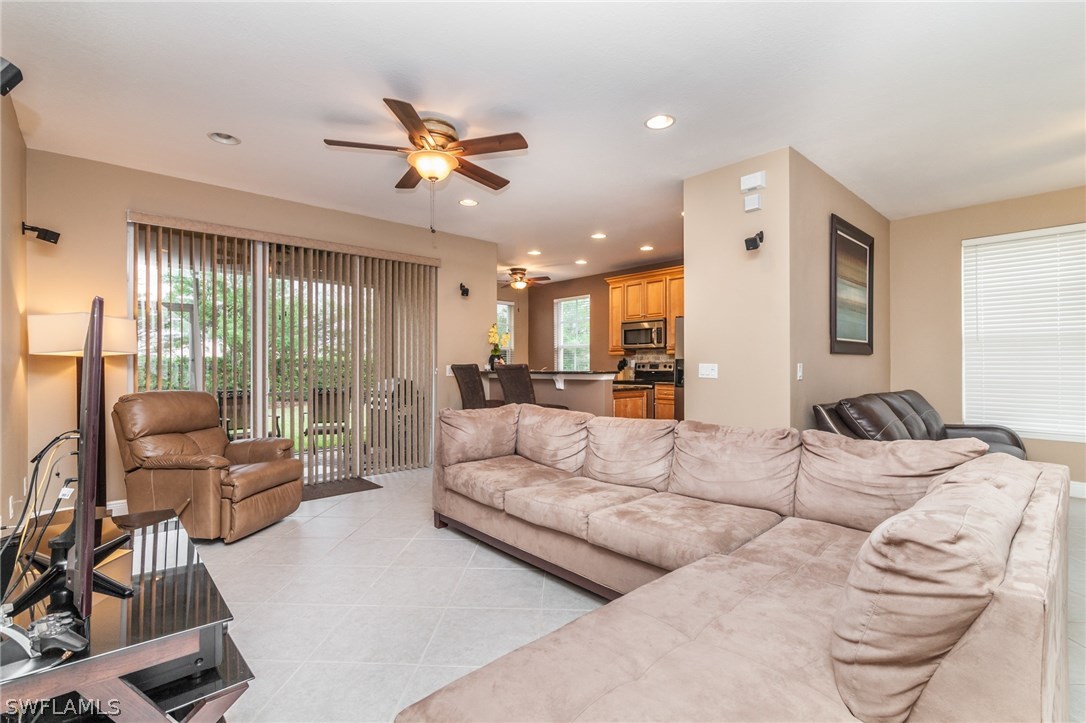 3968 Cherrybrook Loop Fort Myers, FL 33966 - Photo 7 of 16 a living room with furniture and a large window