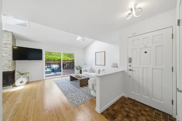 a bathroom with a toilet a sink and a mirror