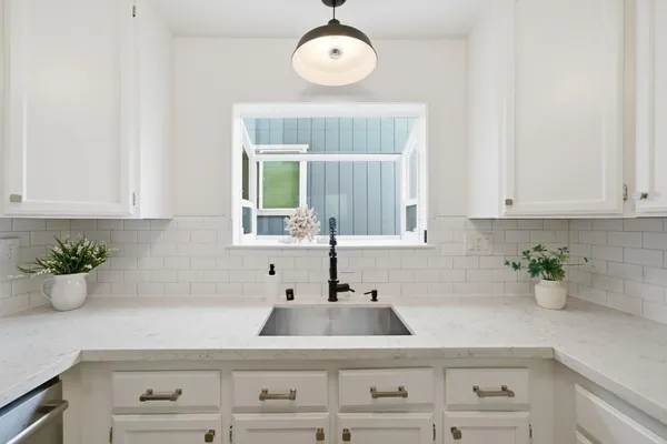a view of a workspace with furniture and wooden floor