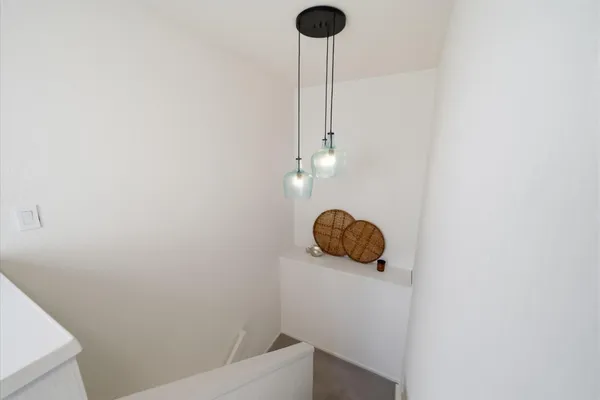 a bedroom with a bed and a potted plant