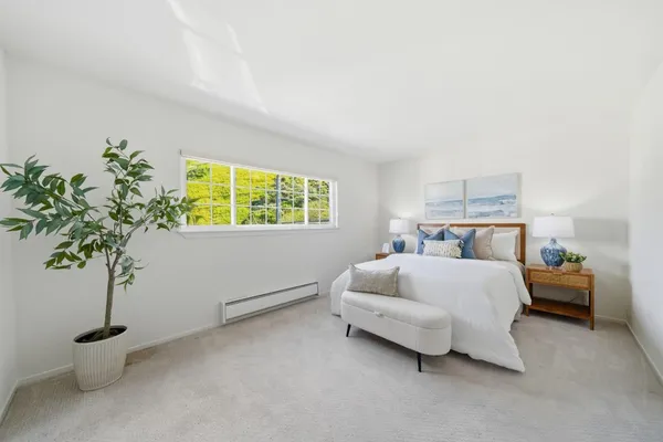 a bed room with bed and a window