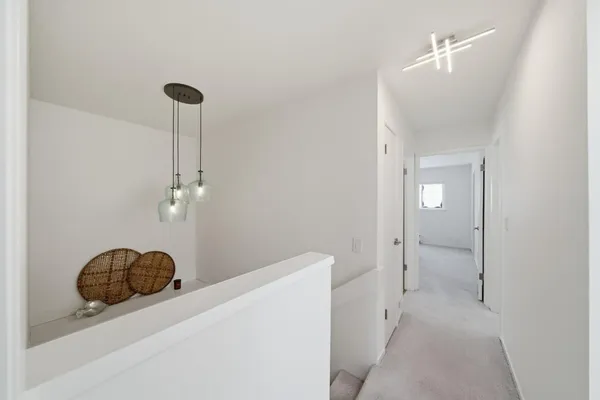 a bathroom with a double vanity sink a mirror and a bathtub