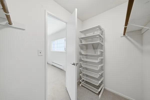 a front view of a house with parking space