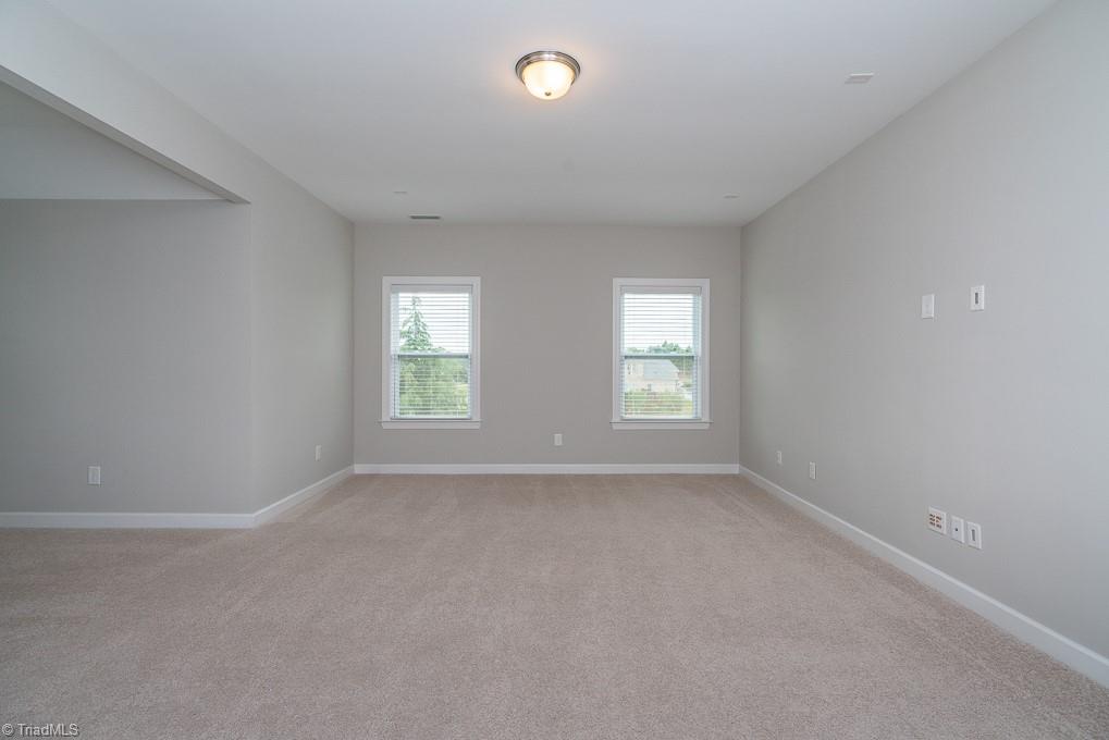 8200 Brotherstwo Road Colfax, NC 27235 - Photo 19 of 50 Huge living room with recessed lighting, ceiling fan, lots of windows, and gas log fireplace.