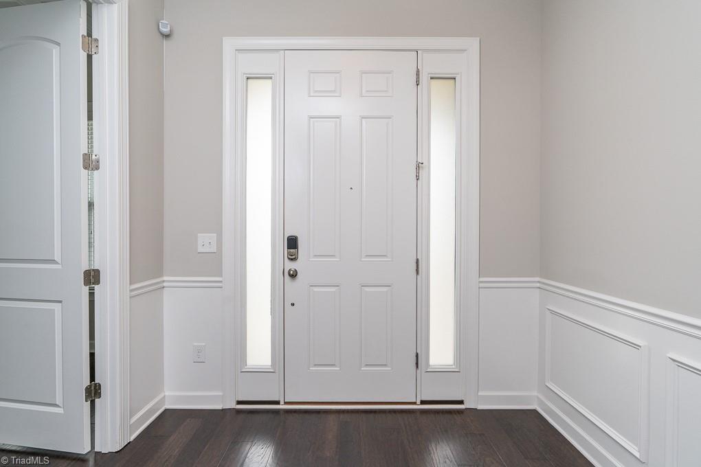 8200 Brotherstwo Road Colfax, NC 27235 - Photo 3 of 50 Covered entry protects your guests from the elements and wrap around front porch is so charming!