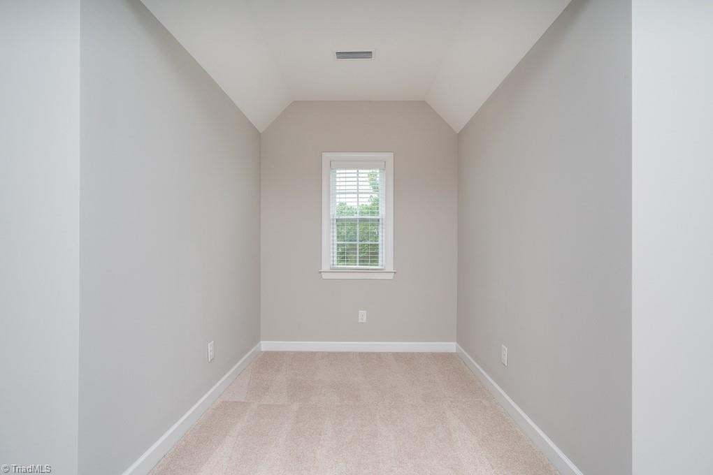 8200 Brotherstwo Road Colfax, NC 27235 - Photo 21 of 50 Powder room located on the main level features pedestal sink and wainscoting.