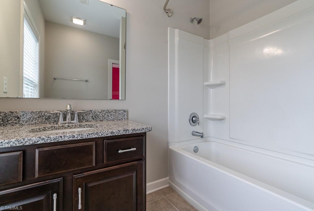 8200 Brotherstwo Road Colfax, NC 27235 - Photo 25 of 50 Bedroom two features two large windows, nice sized closet, and access to full bath.
