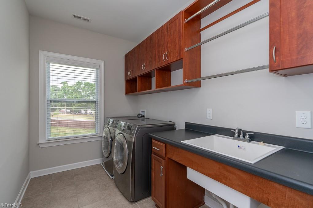 8200 Brotherstwo Road Colfax, NC 27235 - Photo 31 of 50 Full bath sits between third and fourth bedrooms. Double sinks make getting ready easy!