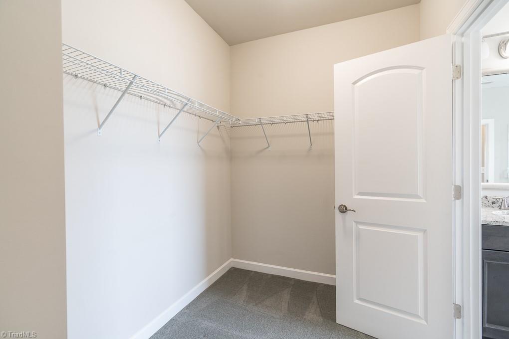 8200 Brotherstwo Road Colfax, NC 27235 - Photo 39 of 50 Tiled shower features bench and niches.