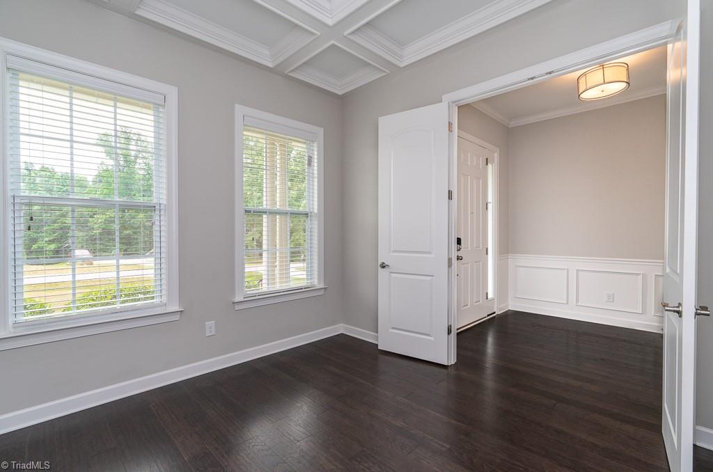 8200 Brotherstwo Road Colfax, NC 27235 - Photo 5 of 50 Door to the left is coat closet. Hallway leads to dining room, kitchen, and great room.