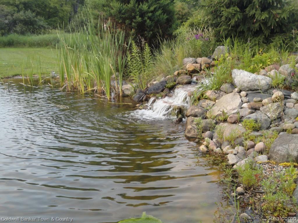 7920 North Fleming Road Howell, MI 48855 - Photo 36 of 36 Pond with Waterfall
