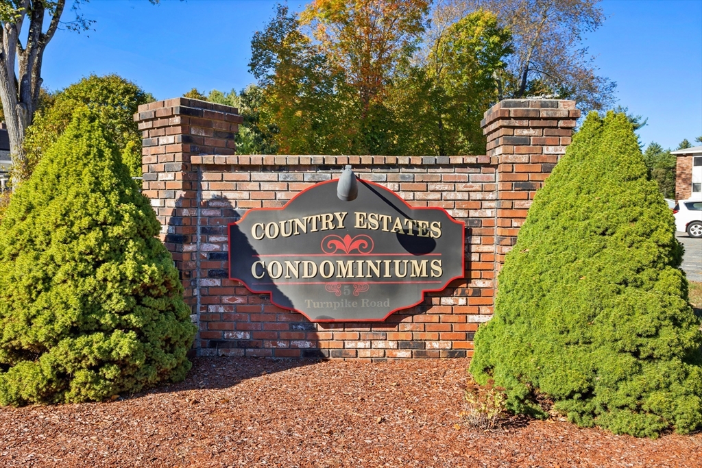 5 Turnpike Road, Unit 229 Townsend, MA 01469 - Photo 1 of 20 a view of outdoor space with signage and flags
