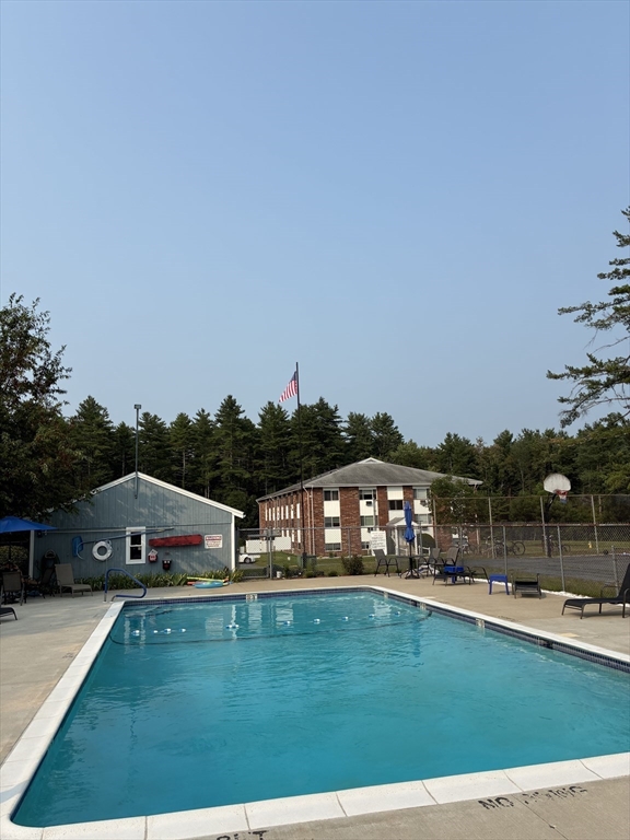 5 Turnpike Road, Unit 229 Townsend, MA 01469 - Photo 19 of 20 a view of houses with yard and outdoor seating