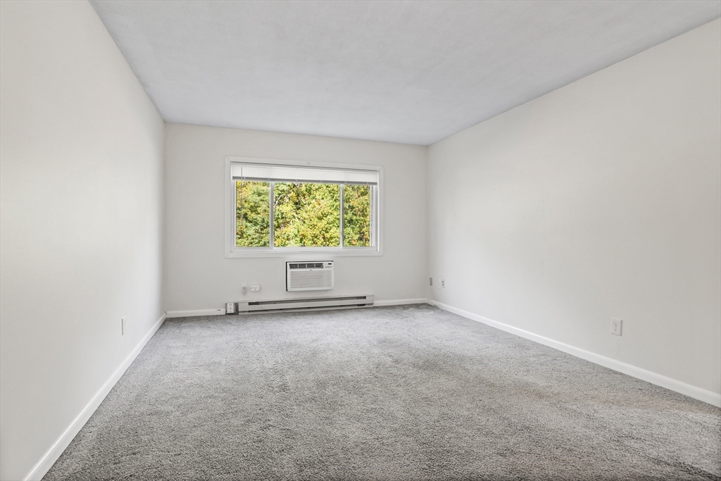 5 Turnpike Road, Unit 229 Townsend, MA 01469 - Photo 5 of 20 an empty room with windows