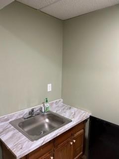 a room with a sink and cabinets