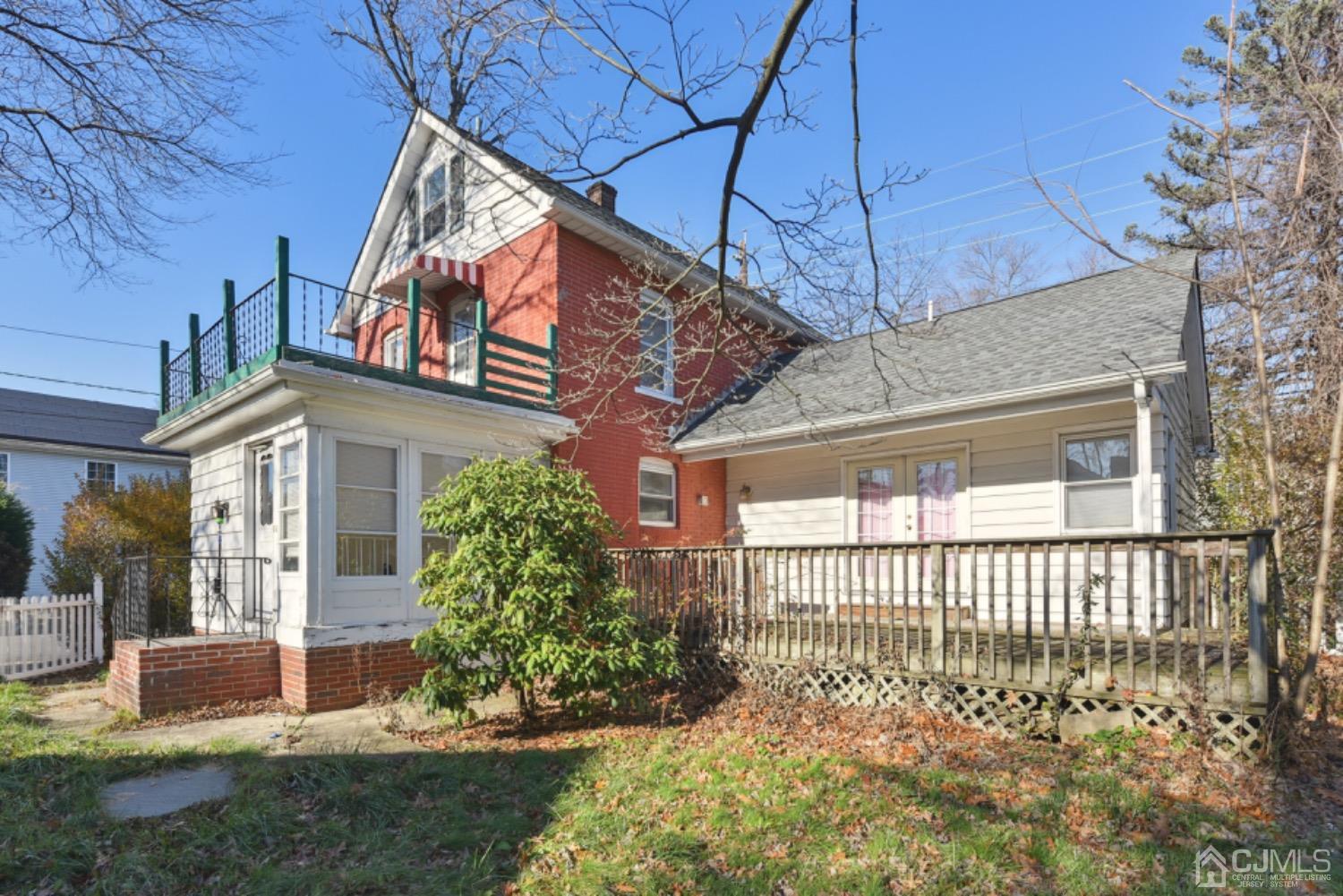 711 Old Post Road Edison, NJ 08817 - Photo 4 of 27 a front view of a house with a yard