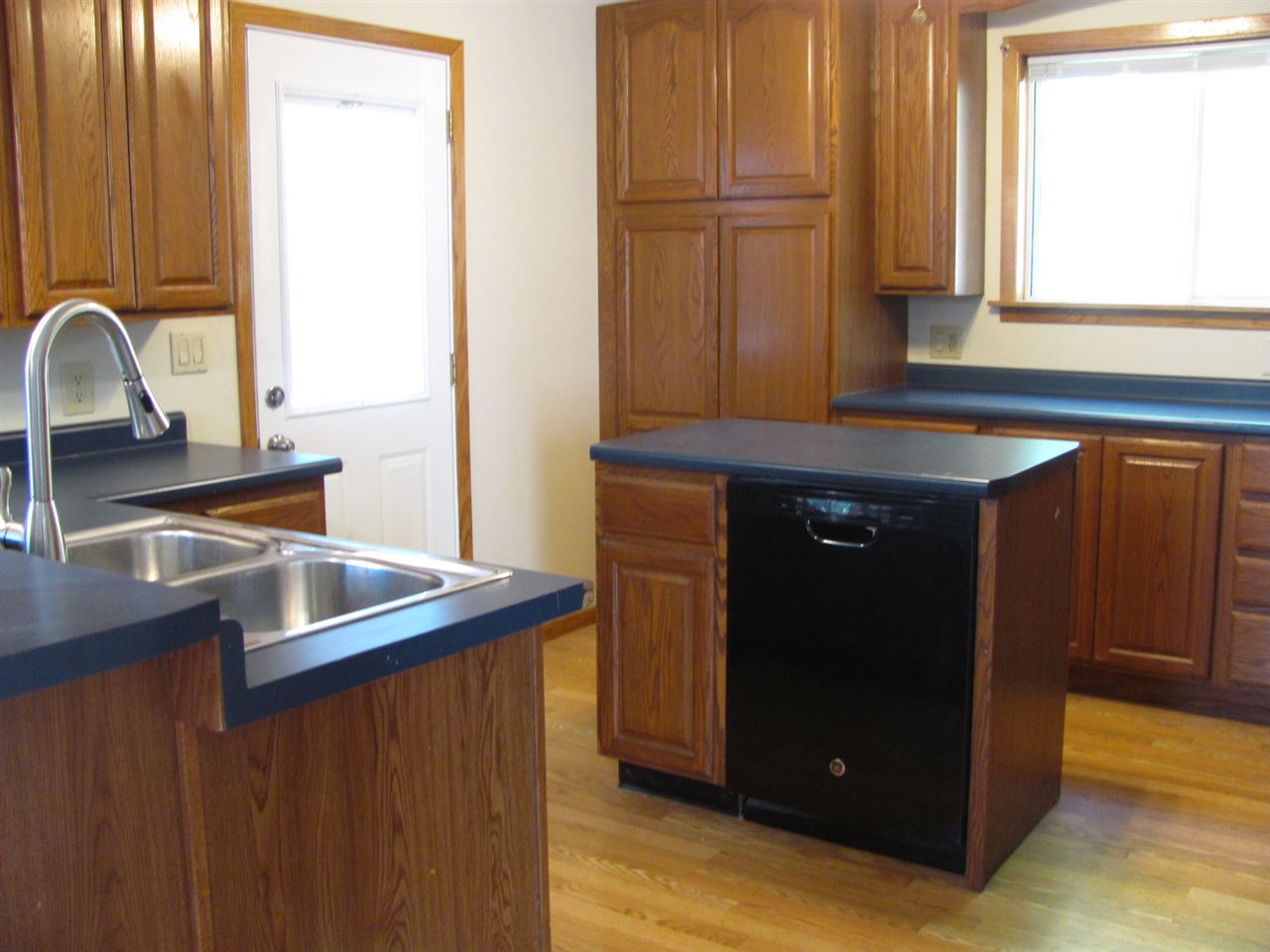 852 10th Street Beloit, WI 53511 - Photo 4 of 20 a kitchen with a sink and a window