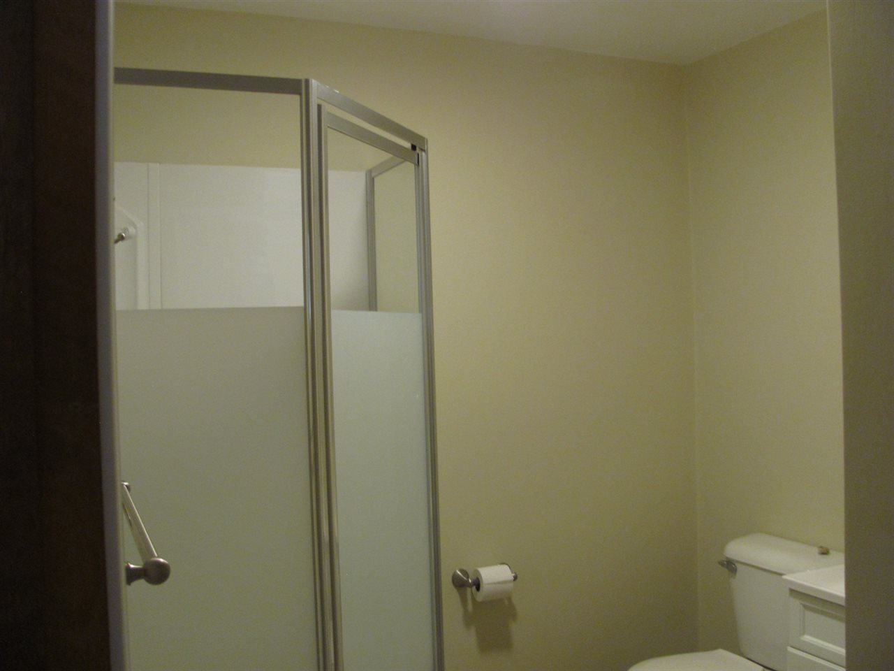 852 10th Street Beloit, WI 53511 - Photo 9 of 20 a bathroom with a granite countertop toilet and a sink