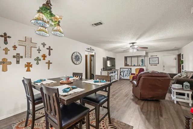 a living room with furniture and a table