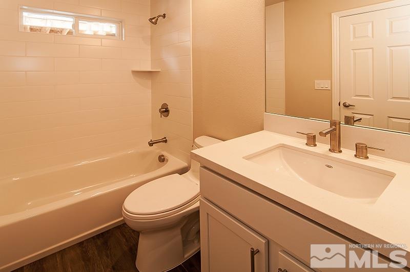 72 Caliente Street Reno, NV 89509 - Photo 8 of 12 a bathroom with a sink a toilet and shower