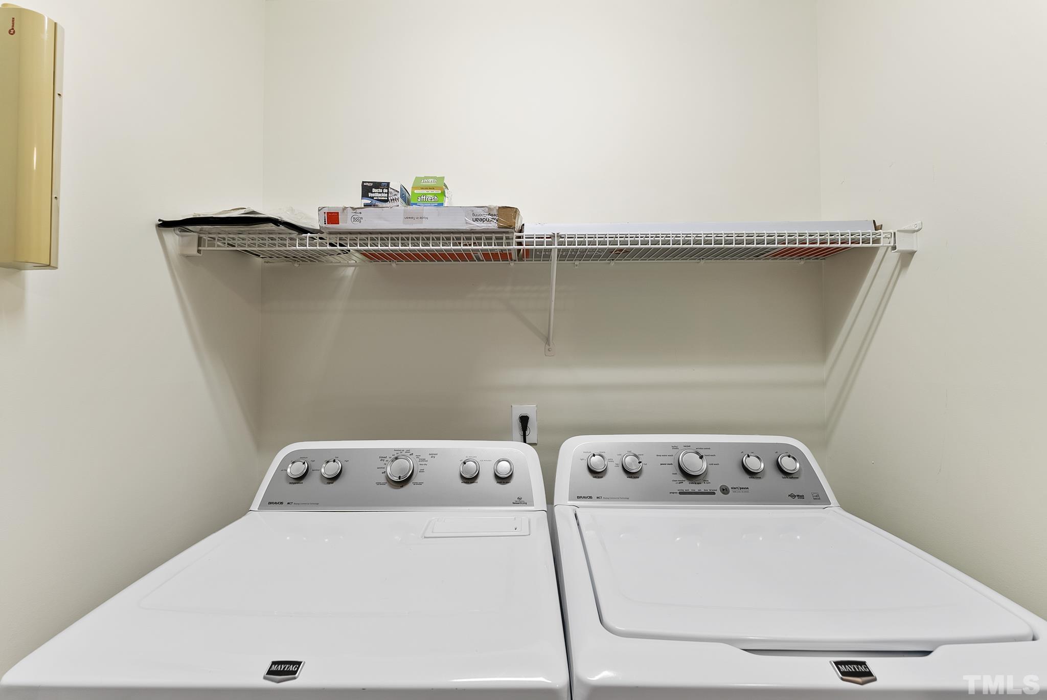 8706 Leeds Forest Lane Raleigh, NC 27615 - Photo 11 of 22 a utility room with dryer and washer