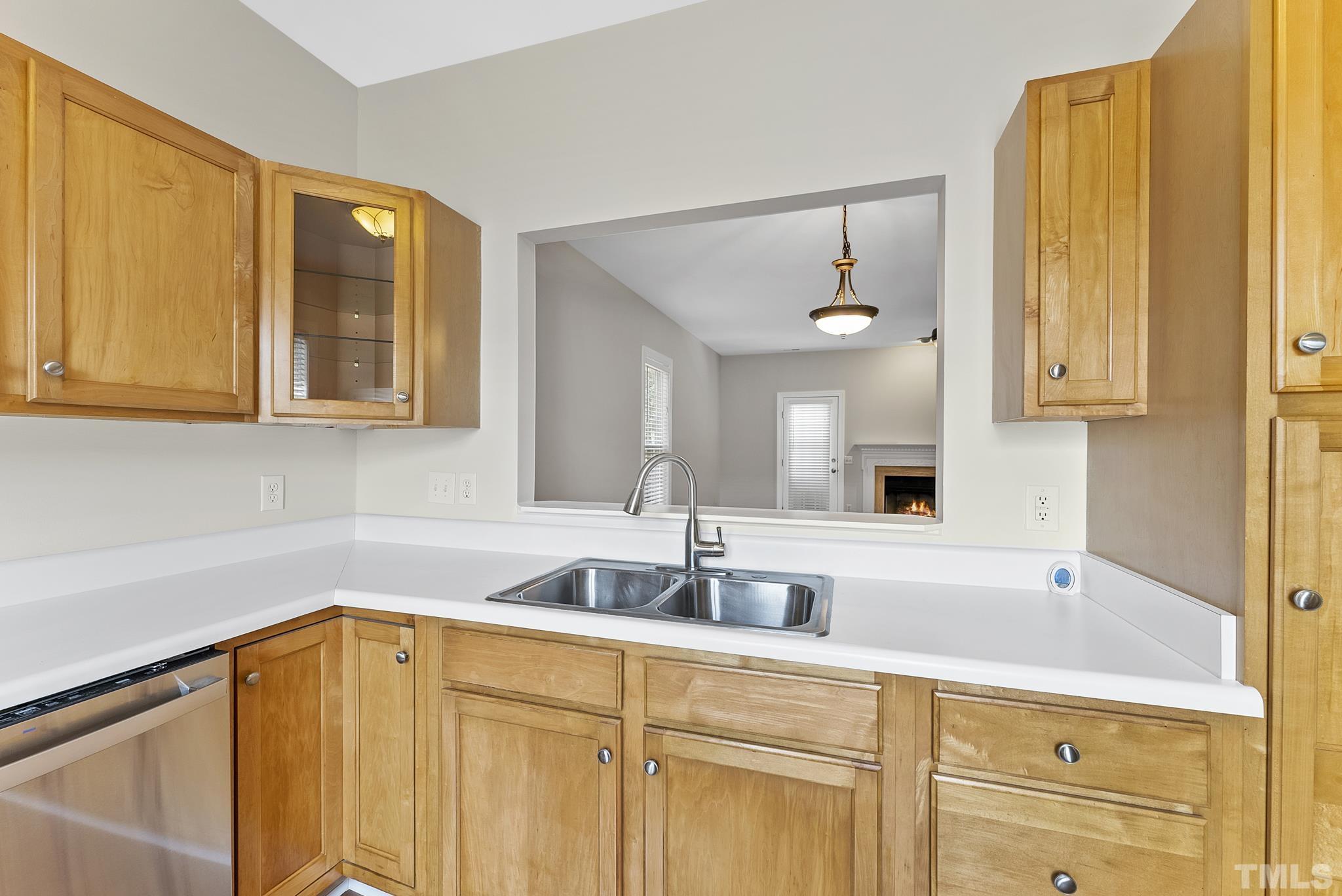 8706 Leeds Forest Lane Raleigh, NC 27615 - Photo 13 of 22 a kitchen with a sink and cabinets