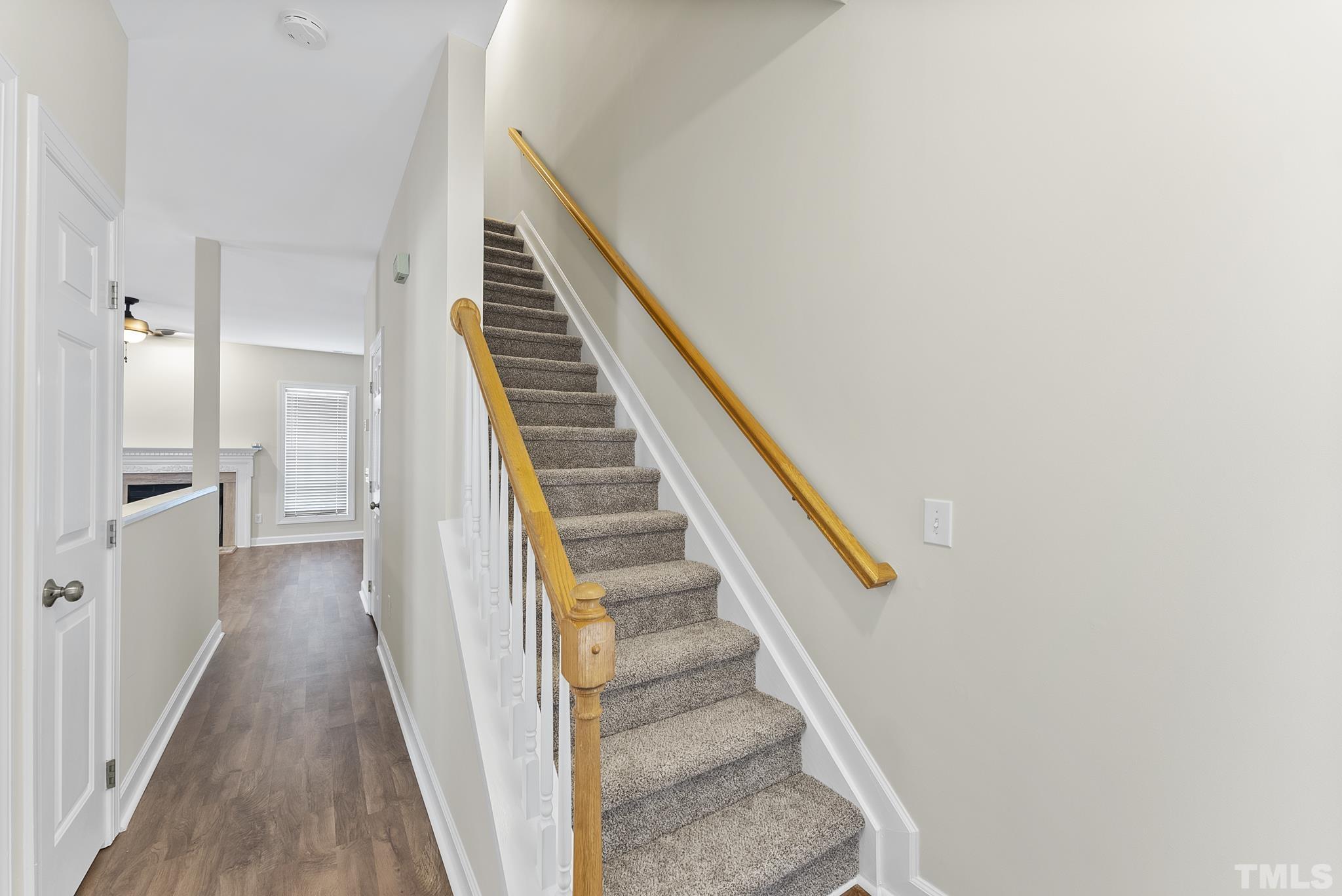 8706 Leeds Forest Lane Raleigh, NC 27615 - Photo 2 of 22 a view of entryway and gallery with wooden floor