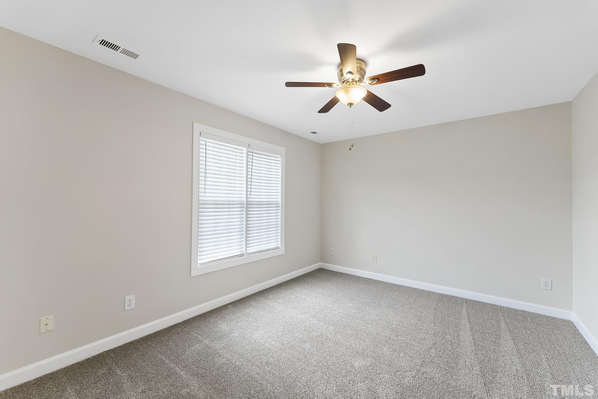 8706 Leeds Forest Lane Raleigh, NC 27615 - Photo 21 of 22 a view of an empty room with a window