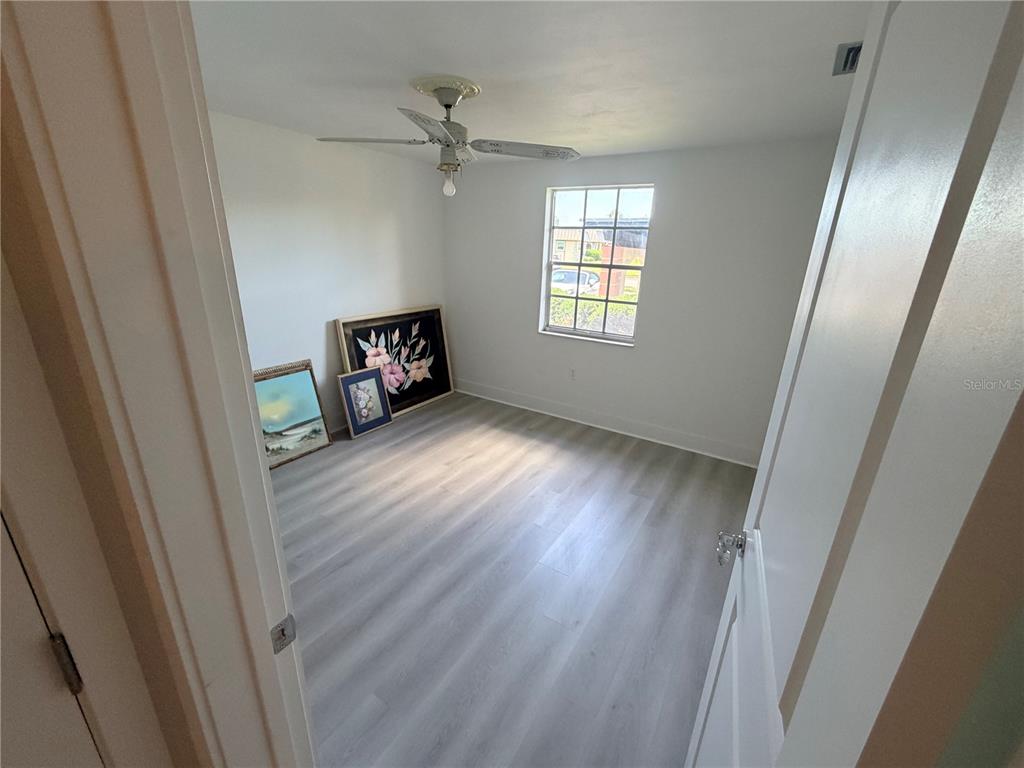 4446 Rustic Drive, Unit E New Port Richey, FL 34652 - Photo 11 of 12 a view of an empty room and window