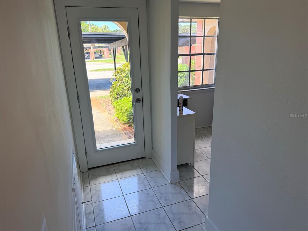 4446 Rustic Drive, Unit E New Port Richey, FL 34652 - Photo 2 of 12 a view of an empty room with a window