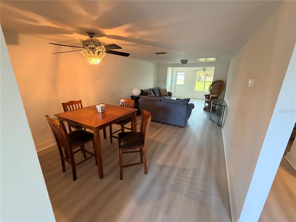 4446 Rustic Drive, Unit E New Port Richey, FL 34652 - Photo 3 of 12 a view of a livingroom with furniture and a table