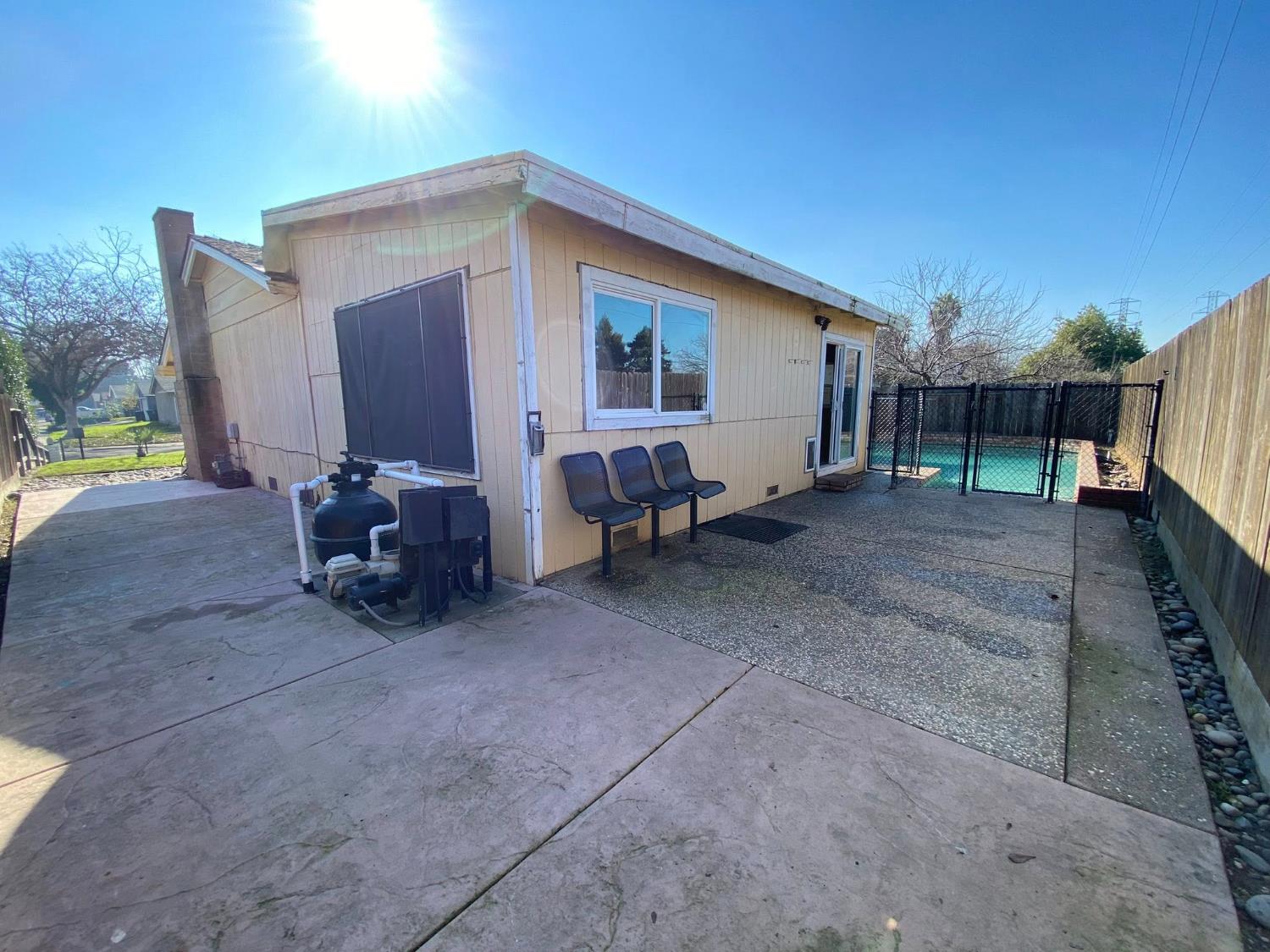 1201 Chateaugay Drive Modesto, CA 95356 - Photo 21 of 32 a view of a backyard with sitting area and garage
