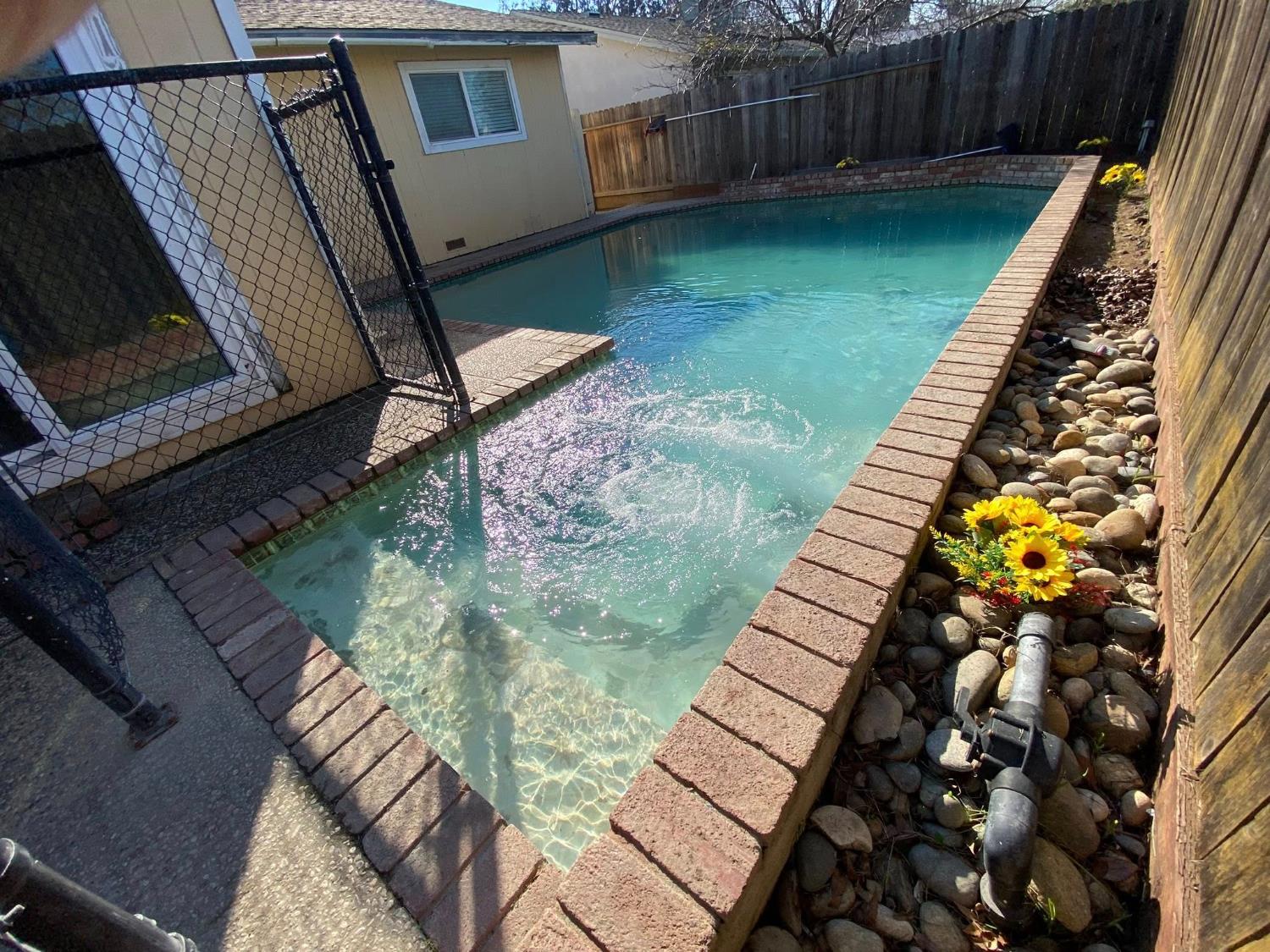 1201 Chateaugay Drive Modesto, CA 95356 - Photo 23 of 32 a backyard of a house with lots of green space