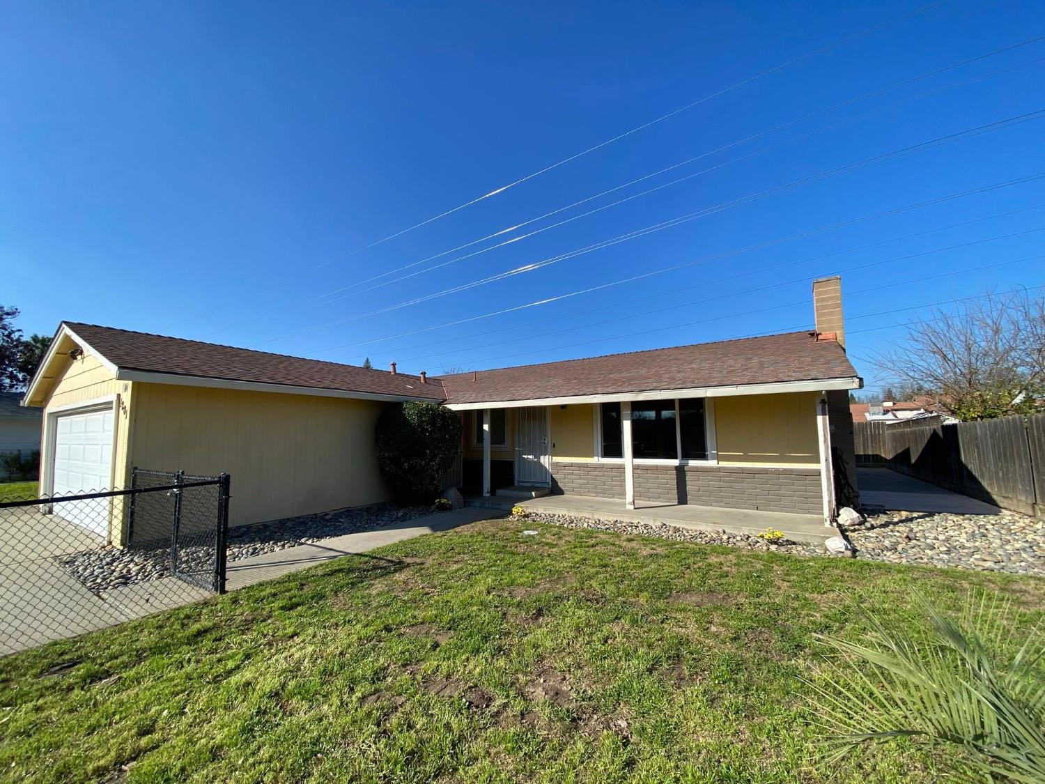 1201 Chateaugay Drive Modesto, CA 95356 - Photo 4 of 32 a backyard of a house with table and chairs