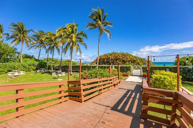 a view of a street with a building in the background