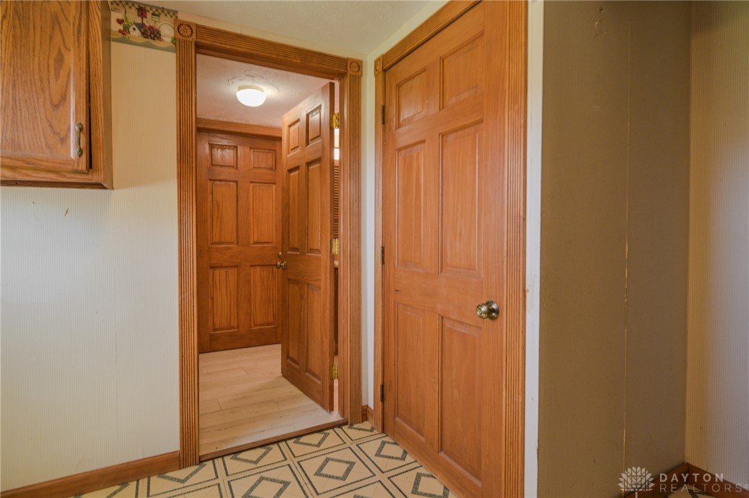 3057 Springfield Xenia Road Springfield, OH 45506 - Photo 21 of 37 This interior hallway features classic hardwood doors and distinct flooring patterns, creating a inviting ambiance.