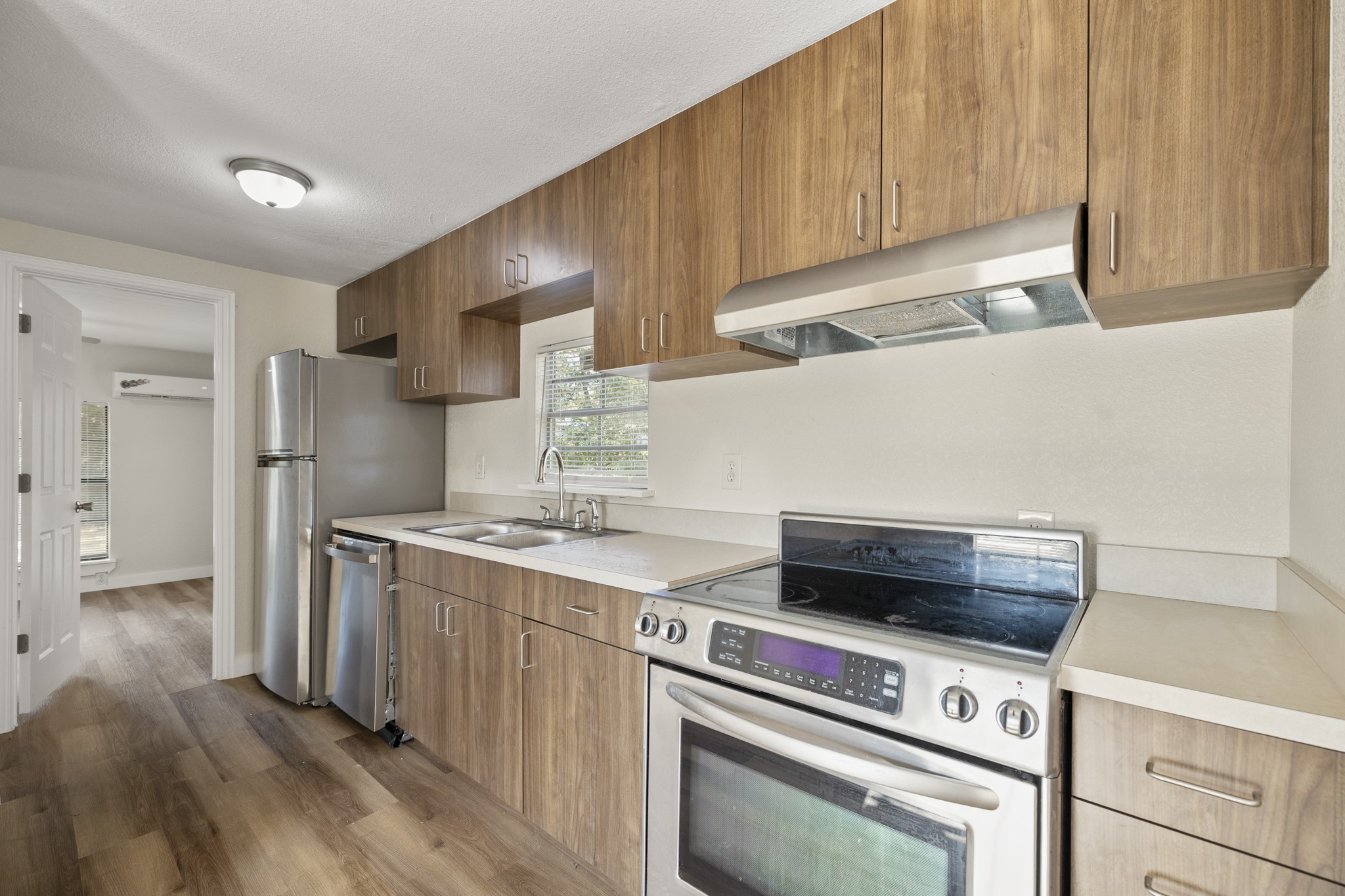 37111 Middle Trail Magnolia, TX 77354 - Photo 11 of 36 a kitchen with a stove and a refrigerator