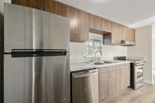 a kitchen with a sink and cabinets