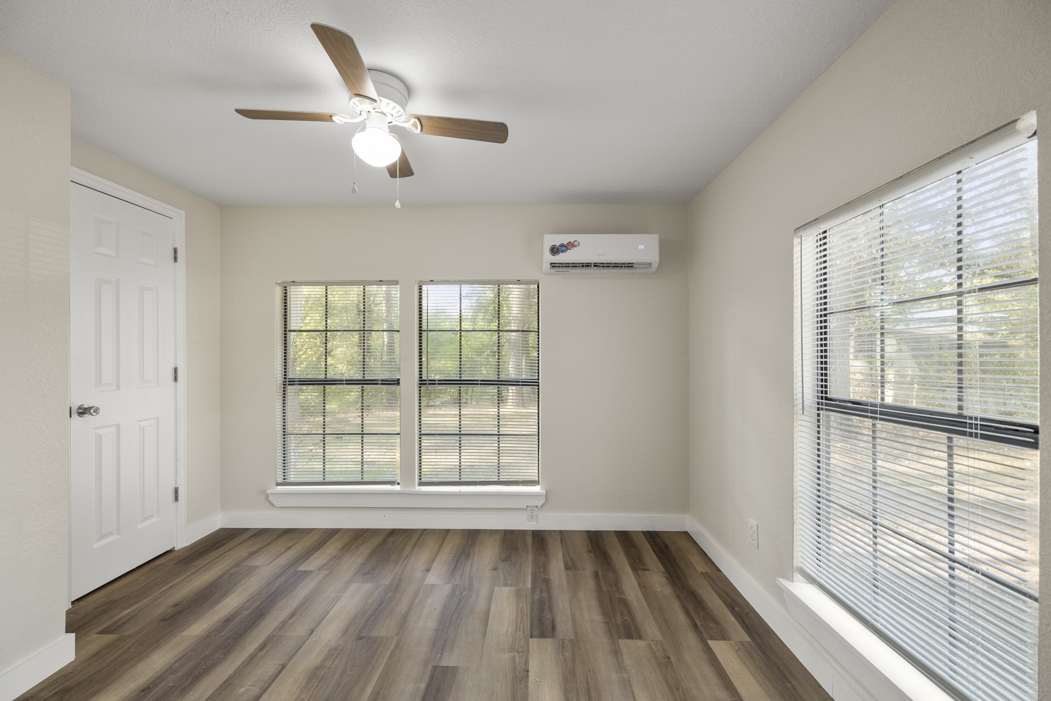 37111 Middle Trail Magnolia, TX 77354 - Photo 14 of 36 a view of an empty room with a window and wooden floor