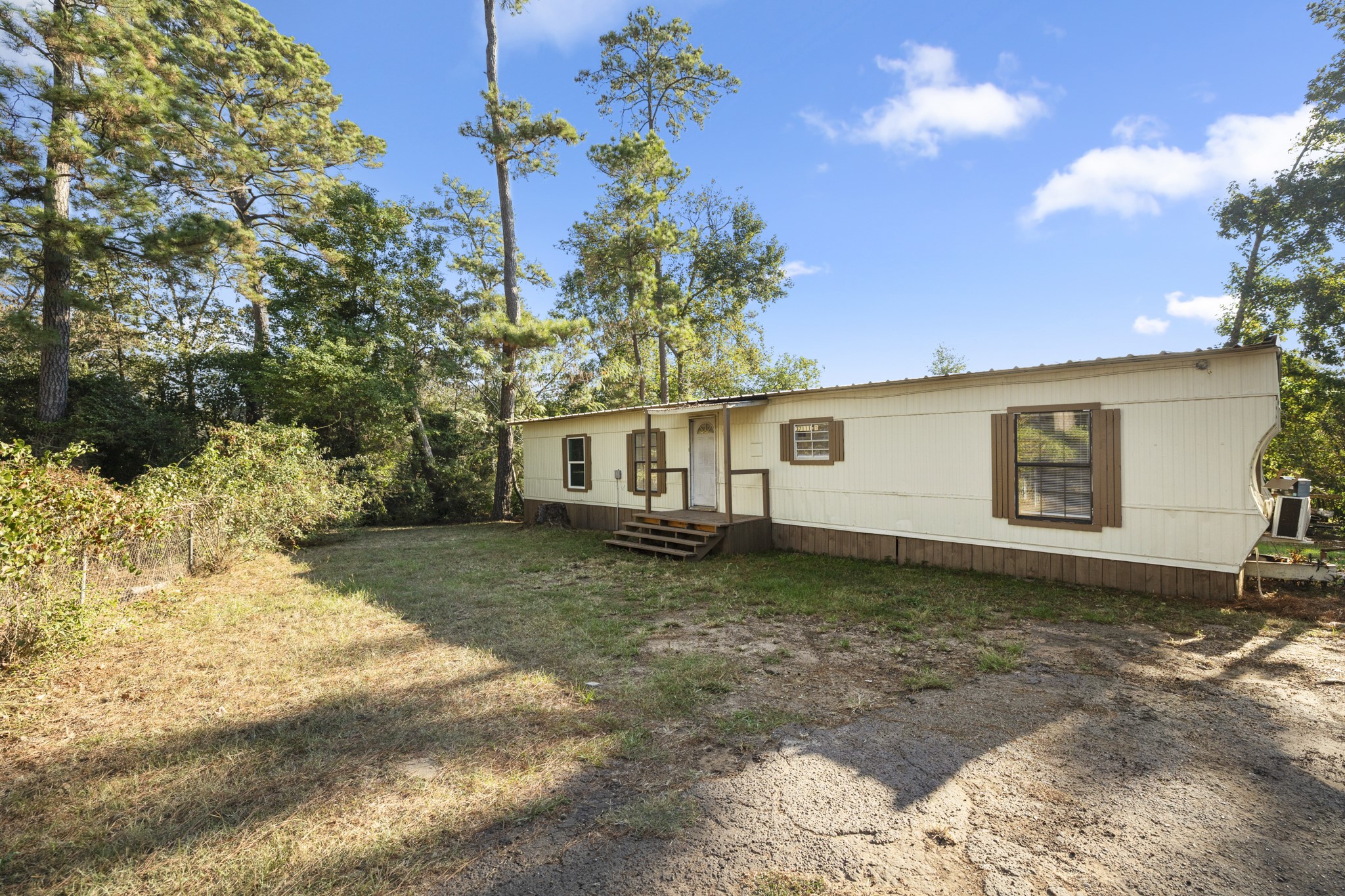 37111 Middle Trail Magnolia, TX 77354 - Photo 2 of 36 a front view of a house with garden