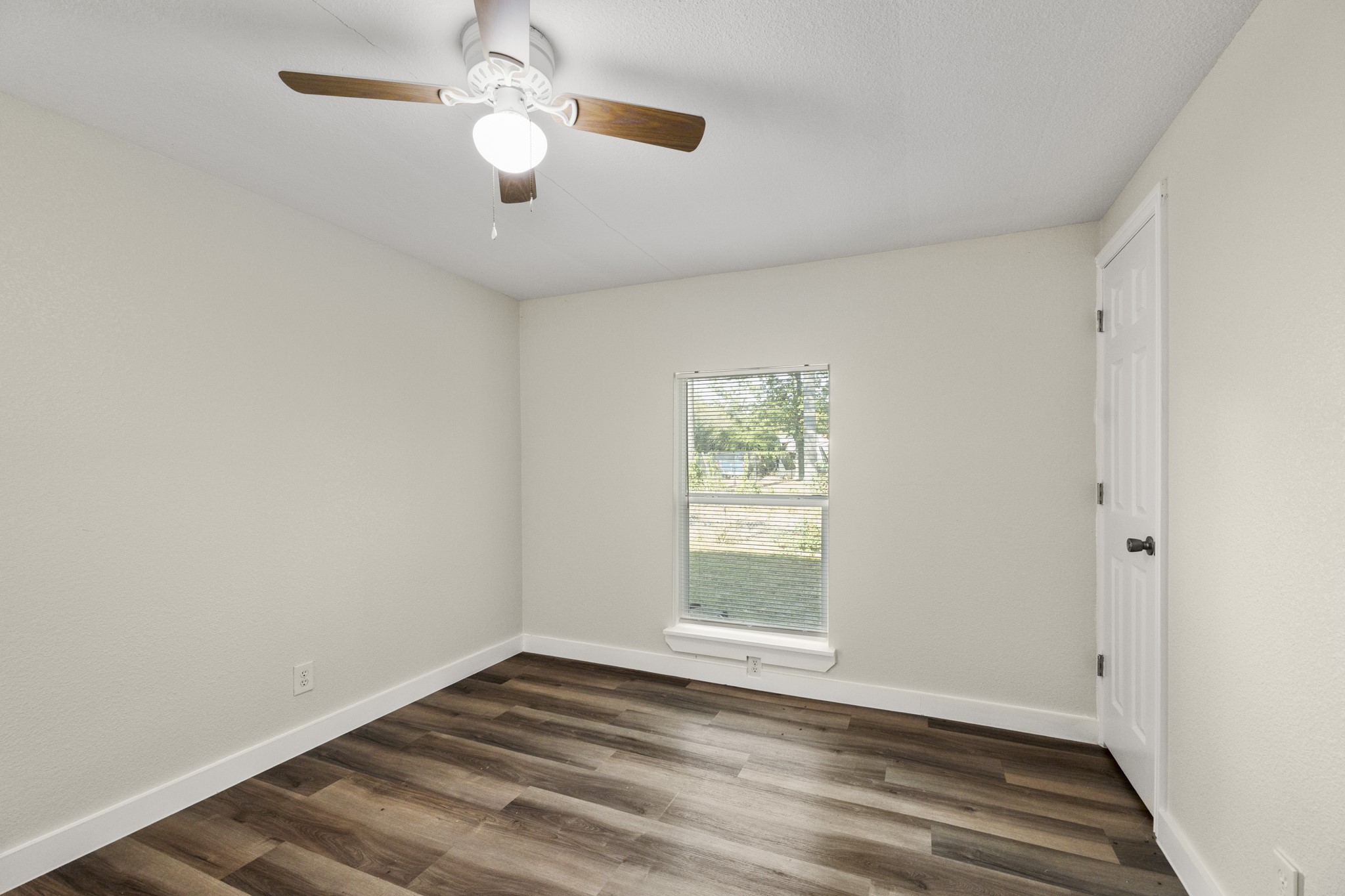 37111 Middle Trail Magnolia, TX 77354 - Photo 21 of 36 wooden floor in an empty room with a window