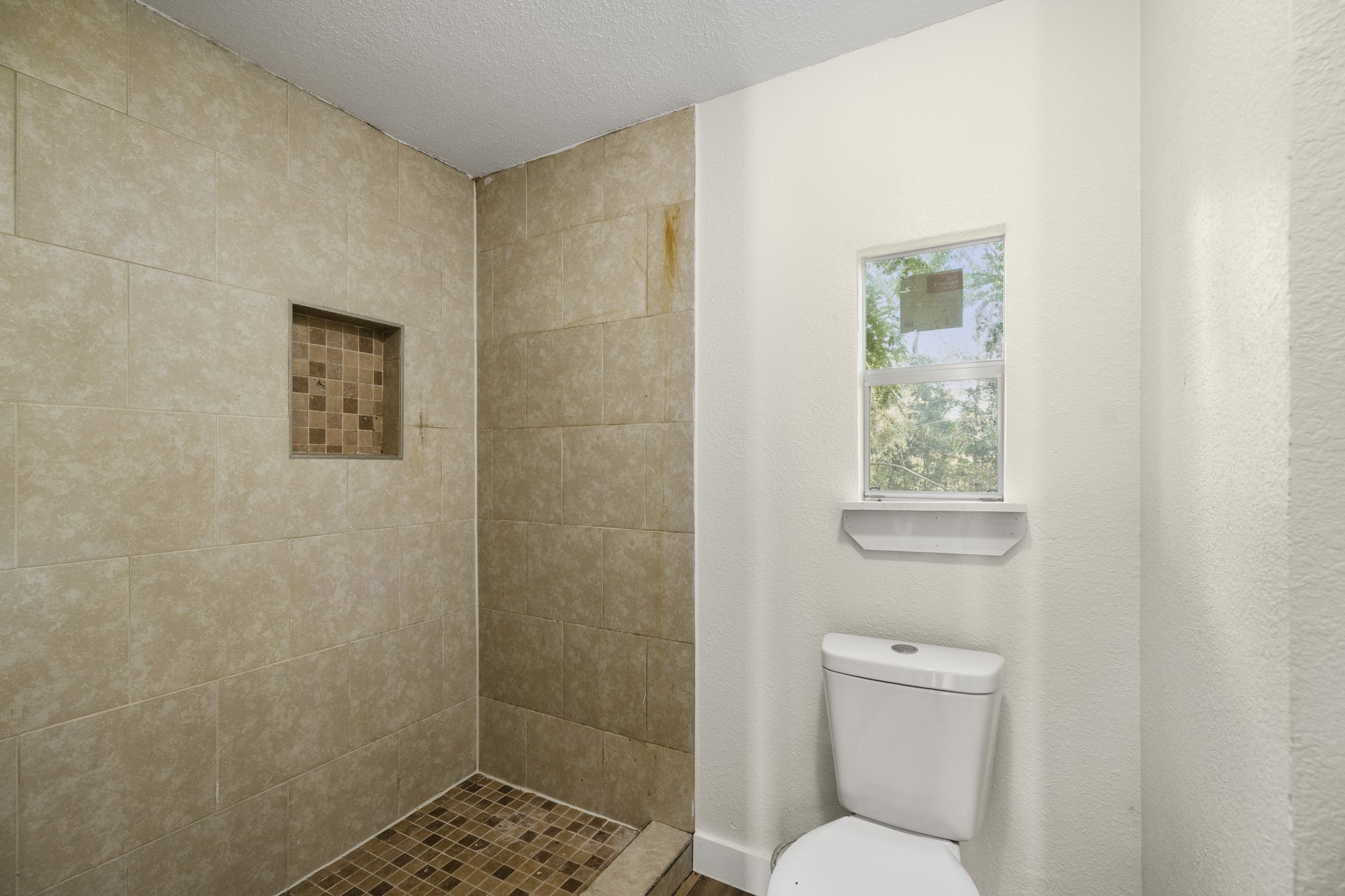 37111 Middle Trail Magnolia, TX 77354 - Photo 22 of 36 a bathroom with a toilet and a shower