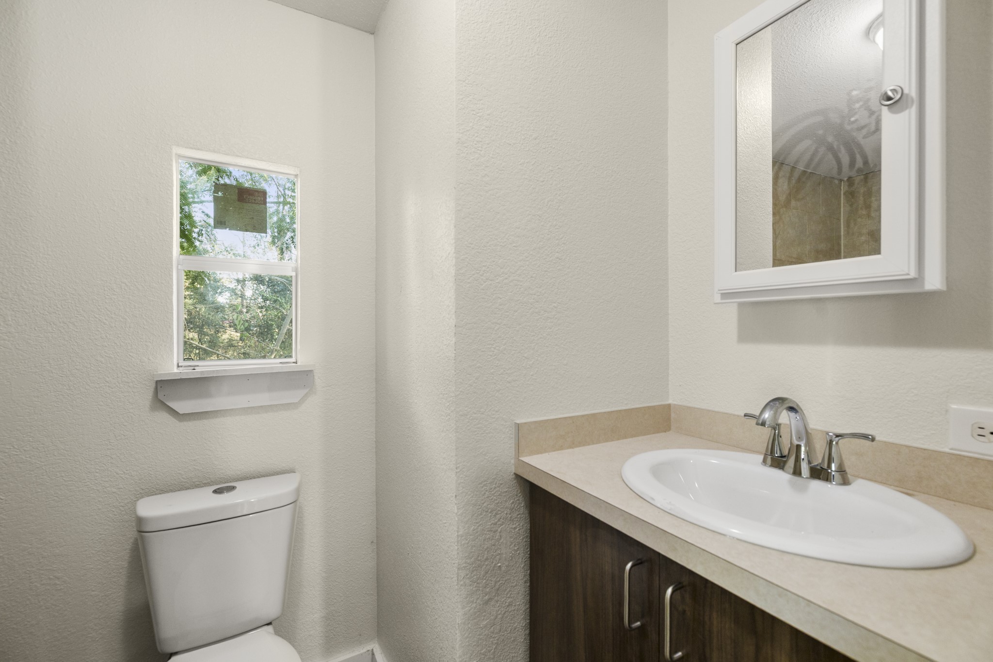 37111 Middle Trail Magnolia, TX 77354 - Photo 23 of 36 a bathroom with a sink and a toilet
