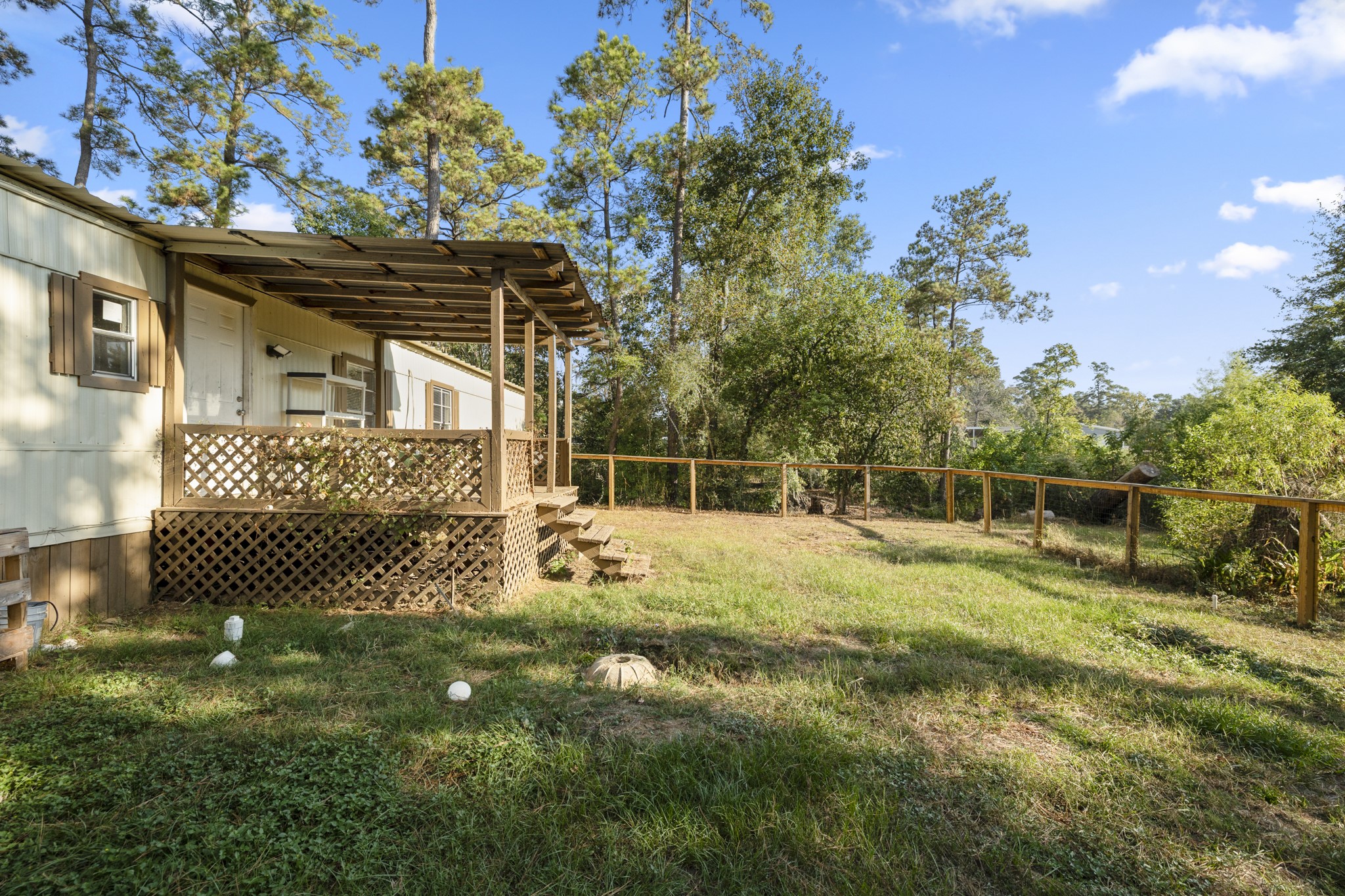 37111 Middle Trail Magnolia, TX 77354 - Photo 25 of 36 a backyard of a house with table and chairs